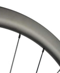 Close-up of Beefy 40mm Disc Brake Road Bike Wheelset, 25mm width, carbon fiber rim, showcasing sleek U shape.
