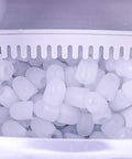 Close-up of ice cubes inside the Top Shelf Countertop Automatic Ice Dispenser With Food Grade Abs Shell And Fast 12 To 15kg Production For Hassle Free Home Mixology Smooth Touch Buttons.