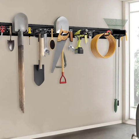 Garage Tool Storage Organizer Wall Mount Kit With Beefed Up 48 Inch Track System And 16 Hooks For Shovels Brooms Rakes And Ladders Holds Up To 600 LB Capacity installed on wall holding various tools