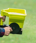 Handheld Grass Seed Spreader For Lawns And Gardens Reusable Fertilizer And Salt Broadcast Spreader Ergonomic Grip in use
