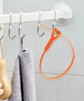 Orange 3 Pack 25 Inch Hair Snake Drain Clog Remover Tool hanging on hook with towel and brush, barbed flexible wand.