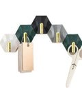 Sleek Adhesive Wall Hooks 4 Pack With Super Tough Grip Tape for hanging tags and scissors on a decorative hexagon wall mount.