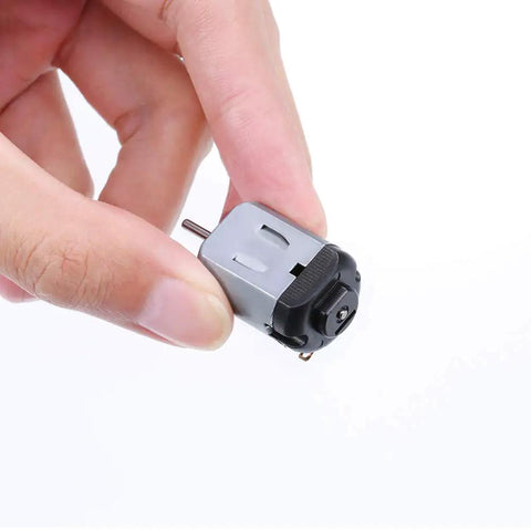 Hand holding a mini DC motor with 10x2mm shaft, part of Six Pack Mini DC Motors 0.5-3V 15000RPM For DIY Toys And Science Projects