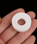 Two white ceramic deep-ball bearings (6001-2RS), sealed, 12x28x8 mm.