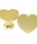 Close-up of gold Heart Shaped Single Hole Door Knob Set, 4 Pack, Zinc Alloy Cabinet Pulls, 34mm, for wardrobes and dressers.