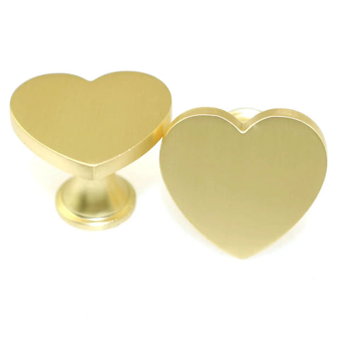 Close-up of gold Heart Shaped Single Hole Door Knob Set, 4 Pack, Zinc Alloy Cabinet Pulls, 34mm, for wardrobes and dressers.