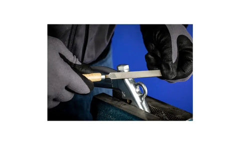 4 Inch Key File Set 265A 6 Piece Second Cut With Quick Mounting Handle Perfect For Delicate And Light Filing Tasks Pro Grade Precision For Tool And Die Making Comes In Protective Pouch Part 17009 being used by a person wearing gloves for filing metal in a vise