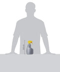 Quick Dry Wood Floor Cleaner Spray For Hardwood Surfaces And Kitchen Cabinets 24oz bottle shown next to a person for scale.