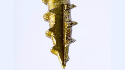 Close-up view of the tip of a Gold Ten By Two And A Half Inch Structural Wood Screw With Washer Head And Star Drive.