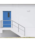 Built Legit Dual Head LED Emergency Light With Multi Voltage And Remote Option For Zero Hassle Snap Fit Install beside blue door.