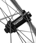 Hub and spokes of Tubeless 45mm Carbon Road Wheelset With 700c Rims And 25mm Tires Disc Brake Compatible Carbon Fiber Toray T700 Spokes UD Matte Finish Shimano 8 9 10 11 Speed Cassette Body Beefed Up High Performance Tubeless Ready Wheelset For Road Bikes