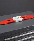 Retractable Spirit Level Ruler for Air Conditioner Indoor Unit on a gray surface, featuring red and white durable material.