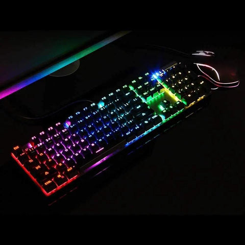 Heavy Duty Mechanical Gaming Keyboard And Mouse Combo Featuring Hella Snappy Blue Switches And Solid Double Shot Keys With Clean RGB Led Backlights For Gamer Rig illuminated with vibrant RGB lights on a desk.