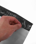 Hand peeling adhesive on 100 Pack White Plastic Mailing Bags With Self Adhesive Seal For Clothes Writable Poly Mailers
