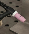 Pro Grade TIG Welding Ceramic Nozzle Cup Set Beefed Up 10 Pack for WP 17 18 26 Torch Sizes 6 8 10 12 Heavy Duty Alumina Gas Lens Cups High Temperature Resistant Up To 1700 C attached to torch.