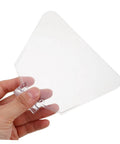 Hand holding a piece from 4 Pack Transparent Bench Grinder Guard Shields Eye Shield Replacement For Workshop Use, Durable Protective Covers.