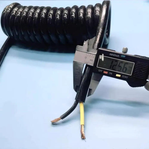Heavy Duty Flexible Coiled Extension Cord Featuring A Rock Solid Spiral Build That Expands To Sixty Feet measuring 12.56mm thickness.