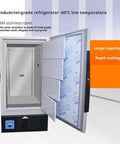 Top Tier Heavy Duty Ultra Low Temp Upright Mini Fridge Freezer For Lab Samples And Supplies Compact Deep Freeze Cold Storage Solution With Rugged Construction And Bulletproof Reliability open door view with stainless steel interior and shelves.