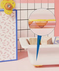 Tough As Nails Furniture Casters Four Pack featuring yellow and pink casters for easy under-toy box movement.