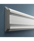 Close-up of 4 Foot GearTrack Channels For Garage Walls Beefy Heavy Duty Wall Mounts, 6 Inch High Panels, on blue wall.