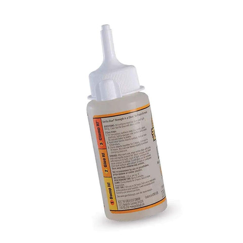 Side view of Clear Glue 3.75 Oz Bottle Non Foaming Formula For Glass And Plastic Repairs, showing nozzle and label details.