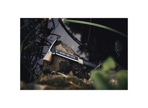 22 Oz Workhorse Framing Hammer With Magnetic Nail Starter on rock, rip claw, milled face, soft mallet cap visible, outdoor setting