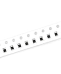 Angled side view of SMD 0805 resistor tape on white carrier strip with black chip resistors.