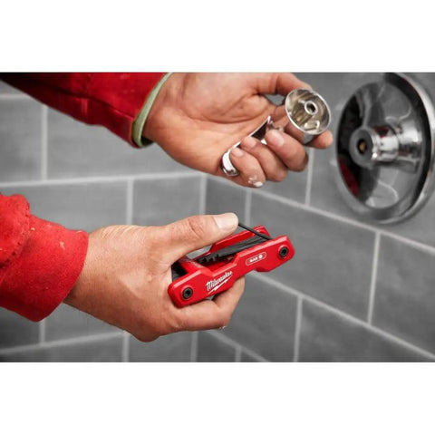 Person using Folding Hex Key Set, 17 Keys, SAE And Metric, Built Tough With All Metal Construction, Heat Treated Alloy Steel for plumbing