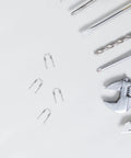 Solid 4pc Kettle Lid Torsion Spring Kit Made From Tough Stainless Steel For Easy DIY Repairs And Total Home Hacks To Fix Loose Lids Fast. stainless steel springs and tools on white background
