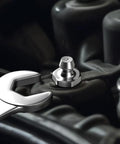 Close-up of wrench and zerk fitting from 240 Piece SAE Grease Fittings Kit With G1/4 And G1/8 Zerk Fittings, Straight 45 Degree 90 Degree Angled.