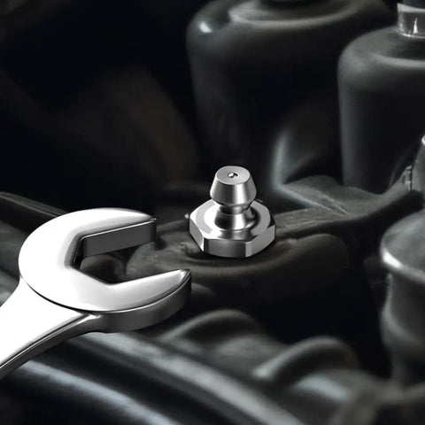 Close-up of wrench and zerk fitting from 240 Piece SAE Grease Fittings Kit With G1/4 And G1/8 Zerk Fittings, Straight 45 Degree 90 Degree Angled.