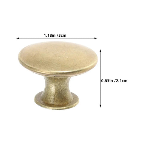 Close-up of a Vintage Round Cabinet Knob in gold finish, showing its size, for Kitchen and Furniture Antique Dresser Pulls.
