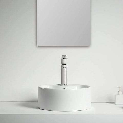 Straight Fire 15.7 Inch Diameter Round Ceramic Bathroom Vessel Sink With Integrated Faucet For Above Counter Installation And Quick Room Glow Up In Crisp White Finish on countertop with a mirror above.
