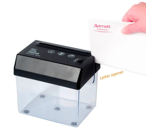 No Hassle Mini Paper Shredder With Built In Letter Opener USB And Battery Powered Quiet Strip Cutter for A6 documents in use.