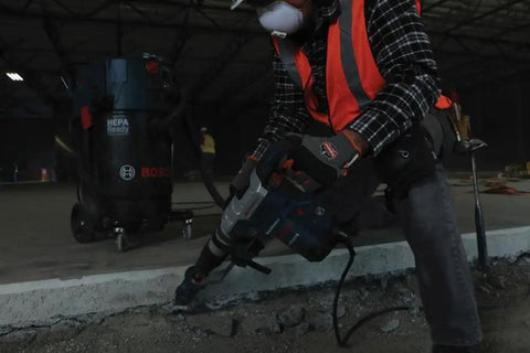 Worker using Heavy-Duty SDS Max Rotary Hammer Drill, 13 Amp, 120V, 6.5 ft-lbs Impact Energy at construction site