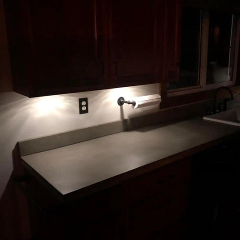 Heavy Duty Water Based Concrete Countertop Sealer Features A Smooth Matte Finish And Food Safe Formula With Low Voc And Two Component Polyurethane Shield For Hella Tough Kitchen Renovations One Kit on a kitchen countertop.