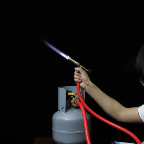 Premium Replaceable Propane Torch For Welding And Brazing With Self Ignition Lock, ergonomic brass gas flamer in use.