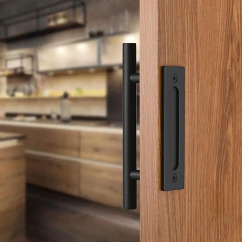 All New 12 Inch Sliding Barn Door Handle Pull And Flush Hardware Set With Flat Back Plate In Rustic Black installed on wooden door