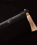 Close-up of Longquan Bamboo Rhythm Tang Sword Hand Forged 1095 High Carbon Steel Blade With Bamboo Pattern Black Scabbard detail.