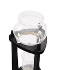Kick Back And Sip Smooth Chills With This Sharp Cold Brew Drip Coffee Maker Crafted From A Borosilicate Pitcher And Real Wood Stand For Hassle Free Iced Coffee Runs That Come Out Fresh And Totally On Point Daily - top view of borosilicate glass pitcher on wooden stand.