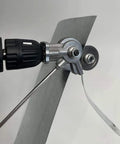 Electric Drill Nibbler Attachment Metal Sheet Cutter Tool for Hand And Impact Cordless Hammer Drills Burr-Free Cutting Steel Aluminum Copper With Complete Accessory Kit For Diy Projects close-up image of attachment cutting thin metal sheet.