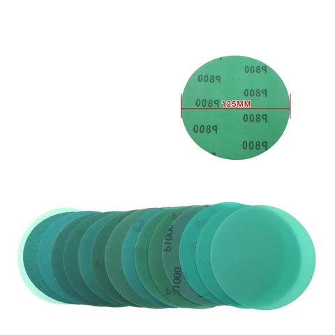 Grab These 30 Piece 5 Inch Hook And Loop Sanding Discs With Green Abrasive Film That Cut Fast And Last Long For Your Orbital Sander Doing Wet Or Dry Work Without Getting Clogged: Various green sanding discs stacked.