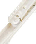 Close-up of 16 inch full extension drawer slides for cabinets and desks with dual slide rails and quiet rollers in white.