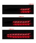 Slick All-In-One Rear Bumper Combo Lights For Tesla Model Y 2020-2023 sequential turn signals glowing in dark.