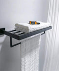 Square Towel Rack With Single Bar Wall Mount Shelf Rustproof Stainless Steel In Matte Black Finish holding white towels.
