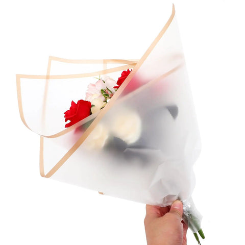Hand holding bouquet wrapped in Floral Bouquet Wrapping Paper Waterproof Protective Wrap Paper 20 Sheets Cuttable