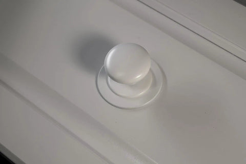 Close-up of Two Pack XL White Bi Fold Closet Dummy Doorknob with Wide Backplate for Wardrobe Dresser Kitchen Cabinets