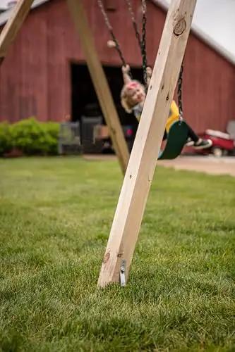 Swing set leg anchored with Playset Anchor Kit For Swing Sets Heavy Duty Ground Anchors That Keep Your Set Rock Solid Stationary And Safer