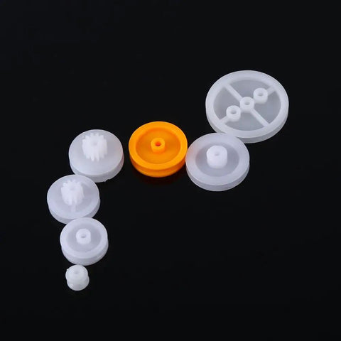 Seven Piece Dope Plastic Pulley Kit For DIY Belts And Model Making, 2A 2B Shaft Fit For 2mm Axle, shown with 7 assorted pulleys