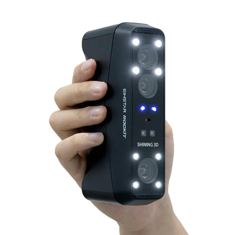 Rockit Wireless Laser 3D Scanner With 38 Blue Laser Lines held in hand, showing front view with lights and camera lenses visible.